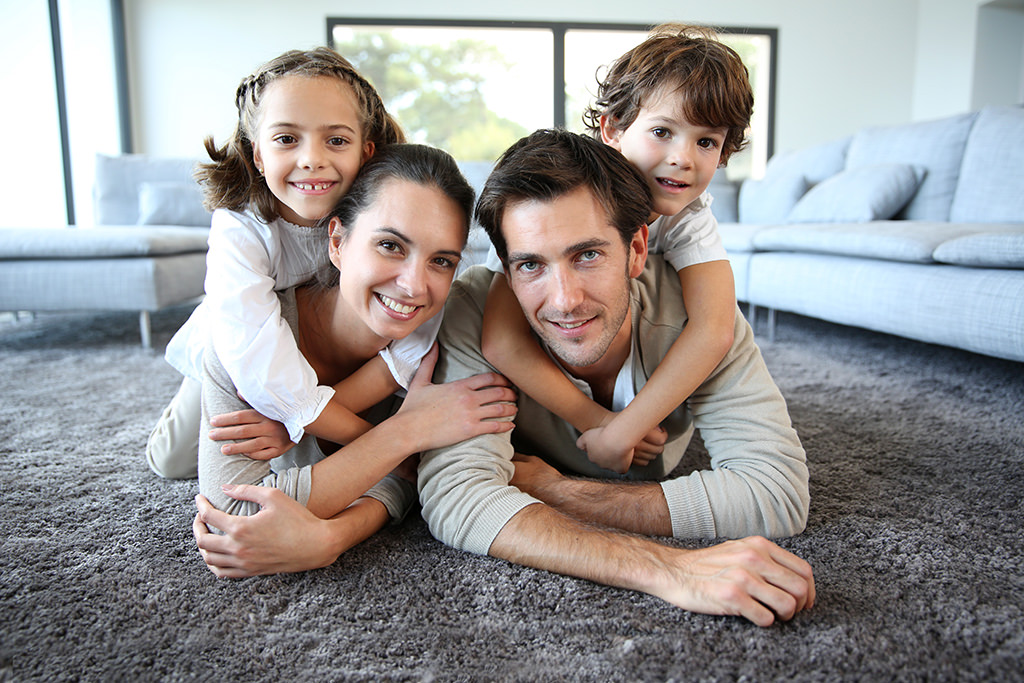 A family that just got their solar installed and super happy. Mum & Dad, two kids.