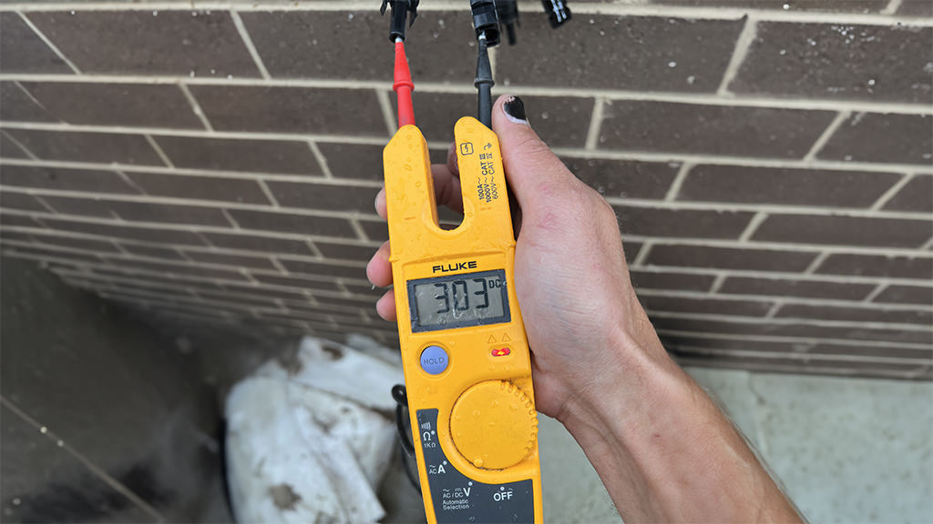 Inspecting and diagnosing issues in a solar panel installation.